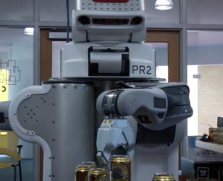 CSAIL researchers converted their lab into a miniature “bar” that included a PR2 robot “bartender” and two four-wheeled Turtlebot "waiters."