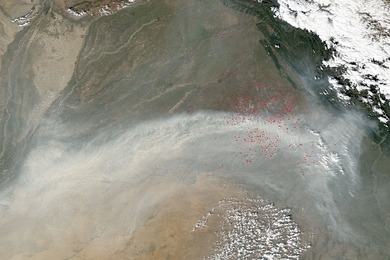 An ''atmospheric brown cloud'' of manmade aerosols produced by agricultural (marked in red) and other fires may reduce monsoon-related rainfall and crop yields in central India. 