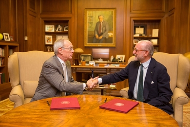 MIT President L. Rafael Reif and Gianfelice Rocca sign documents renewing a partnership between the Institute and Politecnico di Milano (POLIMI), Italy's top engineering school.
