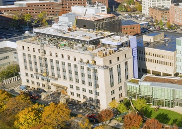 The Morris and Sophie Chang Building (foreground left) borders the vibrant Kendall Square technology hub.