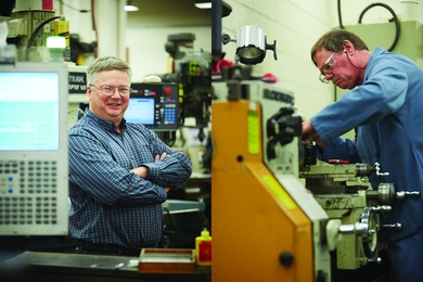MIT Central Machine Shop supervisor Andrew Gallant (left) and machinist Brian Anderson 