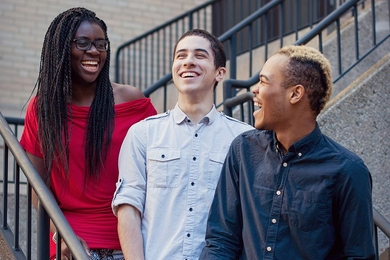 Founding planners of RAK Week, Bettina Arkhurst and Cory Johnson (left and far right), with volunteer graphic designer Daniel Sanchez (center). 