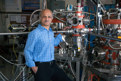 MIT Senior Research Scientist Jagadeesh Moodera stands in front of a custom-built system used to fabricate ultrathin films. His work includes devices that exhibit resistance-free, spin-polarized electrical current; enabling memory storage at the level of single molecules; and the search for the elusive Majorana fermions sought for quantum computing. 