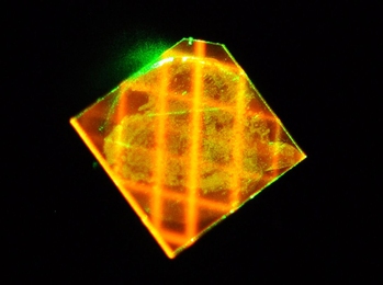 A light-trapping diamond waveguide developed at MIT Lincoln Laboratory is one of the technologies honored with a 2016 R&D 100 Award. The waveguide is capable of efficiently guiding a green excitation laser beam along a meter-long optical path in a millimeter-scale diamond.