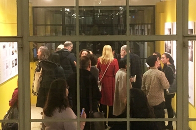 Building 7 Block Party participants explore the Wolk Gallery, as seen from Rotch Library.