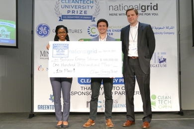Solstice Energy Solutions co-founders Ugwem Eneyo (left) and Cole Stites-Clayton (center) stand with Kristian Bodek of National Grid.
