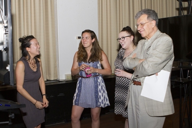 Senior Mary Hwang (left) presents her capstone research to graduate student Madison Noteware, staff member Sarah Smith, and Professor Oral Buyukozturk at the CEE Senior Celebration and Awards Ceremony. 
