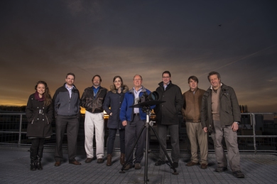 Lincoln Laboratory researchers pose with the LASSOS sensors: (l-r) Emily Clemons, Tom Reynolds, and Brad Crowe of the Air Traffic Control Systems Group; Erin Tomlinson, Rich Westhoff, Brian Saar, Michael Joffe, and John Flint of the Laser Technology and Applications Group.