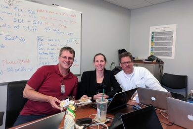 Left to right: Jarrod Goentzel of the MIT Humanitarian Response Lab, Kathy Fulton of the American Logistics Aid Network, and Michael Rettig of the nonprofit LIFT break for lunch after a private sector supply chain coordination call in a FEMA conference room.