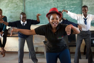 The non-profit Young 1ove designed a course for Botswana schools called “No Sugar” that teaches young girls the high likelihood of contracting HIV from older men called "sugar daddies." Classes begin with ice breakers, such as singing and dancing exercises (shown here). The remainder of the class teaches students risk factors of sugar daddies and how to seek help. The course has reached more t...
