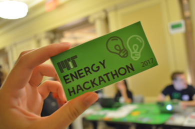 MIT Energy Hackathon leaders handed out stickers at this year's registration tables.