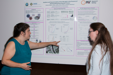 Roxbury Community College Chemistry and Biotechnology Professor Kimberly Stieglitz (left) discusses her summer research at MIT with JoDe M. Lavine, Bunker Hill Community College Professor and Chairperson of the Engineering and Physical Sciences Department, during the annual Summer Scholars Poster Session on Aug. 3. Stieglitz worked in the lab of AMAX Career Development Assistant Professor in Mater...