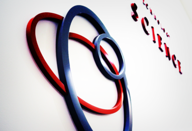 Red and blue circles that are part of a logo