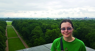 Carissa Skye a third-year physics major who interned at Shell in Hamburg, Germany, poses at the top of the Hamburg Planetarium.