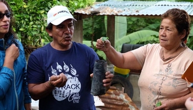 Colombian farmers demonstrate the coffee-growing process to D-Lab students.