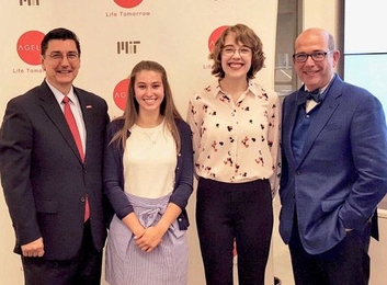 MIT AgeLab’s Joe Coughlin (right) and AARP’s Michael Festa (left) present OMEGA Scholarship awards to Rachel Schultz and Marley Belanger. Not pictured: Caroline Collins-Pisano. 