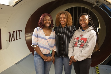 High school students (l-r) Mikayla Sharrieff, India Skinner, and Bria Snell, whose water purification system won them second place in a NASA technology competition, got a tour of the Wright Brothers Wind Tunnel as part of their visit to MIT. The visit was sponsored by AeroAfro, an organization of MIT Aeronautics and Astronautics students.