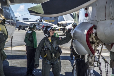 The U.S. Naval Air Systems Command views a shift to model-based systems engineering as an essential step in shortening and modernizing its abilities to deliver high-quality, state-of-the-art programs. Pictured here is Cmdr. Cynthia Dieterly, commanding officer of Carrier Airborne Early Warning Squadron 115 conducts pre-flight checks on an E-2C Hawkeye prior to launch from the Nimitz-class aircraft...