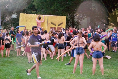 MIT students mob the coveted Trojan Duck, which was created by residents of Simmons Hall.