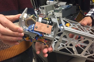 A new laser-pointing platform developed at MIT may help launch miniature satellites called CubeSats into the high-rate data game. 
