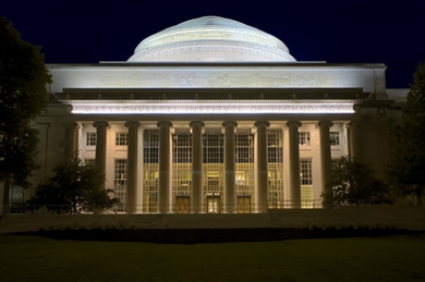 Photo of MIT Building 10 lit up at night