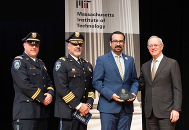 2019 Collier Medal recipient Arman Rezaee (second from right), MIT PhD candidate in the Department of Electrical Engineering and Computer Science, receives his award from Captain Craig Martin (left), MIT Police Chief John DiFava (second from left), and President L. Rafael Reif.