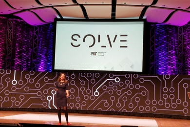 Alex Amouyel announces the 2019 Solve Global Challenges on stage in Kresge Auditorium at the Hello World, Hello MIT event.
