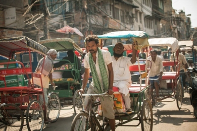 Rickshaw drivers at work in India. A study by MIT economist Frank Schilbach explores the effects of sobriety programs among rickshaw drivers in the country.