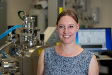 MIT Associate Professor Jennifer Rupp stands in front of a pulsed laser deposition chamber, in which her team developed a new lithium garnet electrolyte material with the fastest reported ionic conductivity of its type. The technique produces a thin film about 330 nanometers thick. “Having the lithium electrolyte as a solid-state very fast conductor allows you to dream out loud of anything else ...