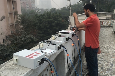 Graduate student Sidhant Pai repairs low-cost air quality sensors near Connaught Place in Central Delhi.
