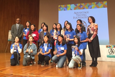 Winners of the 11th Math Prize for Girls, including first-prize winner 8th grader Jessica Wan, stand with Arun Algappan, founder of Advantage Testing (far left) and MIT Professor Gigliola Staffilani (far right)