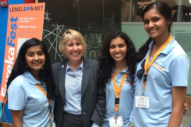  Leigh Estabrooks (second from left) stands with South Brunswick High School InvenTeam members at EurekaFest 2015.