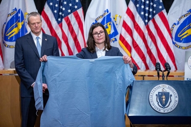 The Massachusetts Emergency Response Team (M-ERT) has been aided by a large group of MIT faculty, students, staff, and alumni as it has helped local manufacturers begin producing personal protective equipment. This photo, from April 13, 2020, shows Gov. Charlie Baker, left, and Brenna Schneider, CEO of 99Degrees, who holds one of the hundreds of thousands of medical isolation gowns her company has...