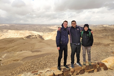 MIT graduate student Nicholas Rivera (middle) and two students from Professor Ido Kaminer's lab visit Masada National Park near the Dead Sea in Israel.