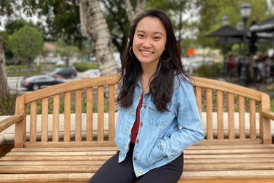 MIT student Ayesha Ng sitting on park bench
