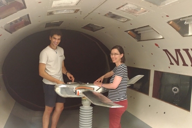 Photo of a student and professor in a wind tunnel