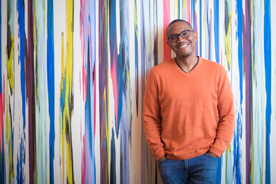 ElDante Winston in front of colorful wall