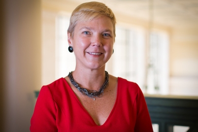 Portrait photo of Linda Griffith with a background of MIT's Lobby 10