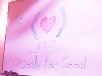 A hand-drawn sign that says "Code for Good" with a heart symbol in between bracket symbols