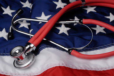 Photo of a stethoscope lying on a U.S. flag
