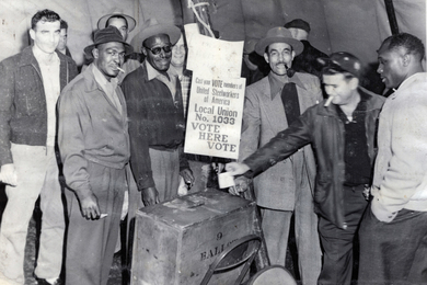 Workers vote in an election