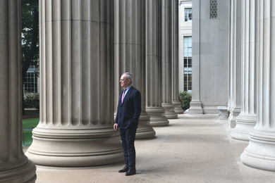 L. Rafael Reif stands among the columns in MIT's Killian Court