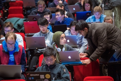 Photo of MIT students sitting in a lecture hall