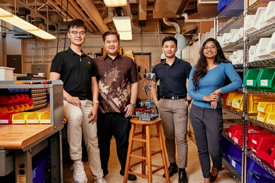 Rui Li, Russel Bradley, Tanach Rojrungsasithorn, and Aviva Jesse Levi pose with FrED, the manufacturing device they developed at MIT.