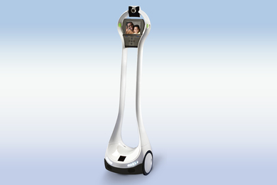 A slender robot on 2 wheels has a video camera and a little screen displaying a waving father and son.