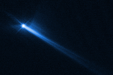 A bright bluish light, which is debris, shoots across the black background, with light trailing behind it.