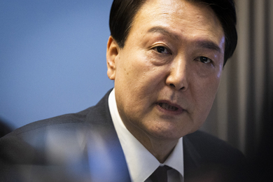 Head-and-shoulders photo of President Yoon Suk Yeol, looking into the camera while speaking