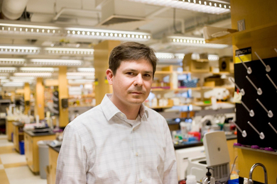 Christopher Voigt stands in a science lab