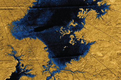 Radar image of a lake taken from high above Titan's surface shows liquid areas as dark blue and land areas as dark yellow