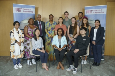 Group photo of Dean Anantha Chandrakasan with 12 postdocs 